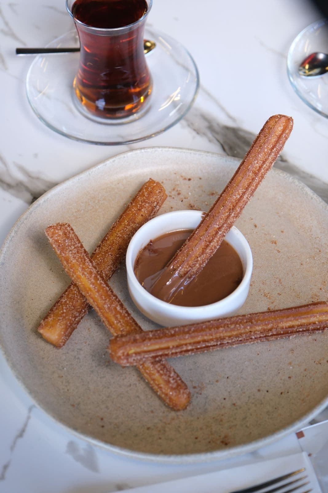 the célcéro churros ve Belçika çikolatası